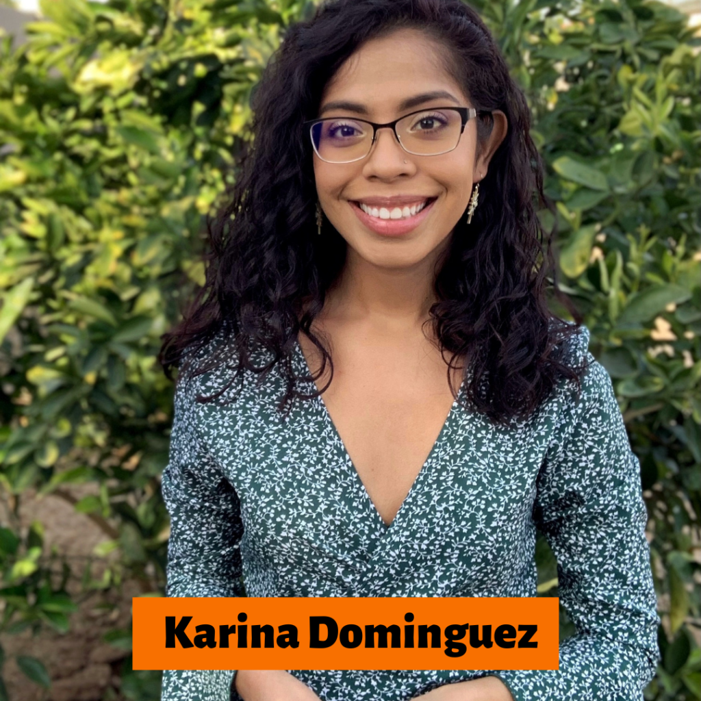 Picture of Karina Dominguez standing in front of a background covered in leaves.